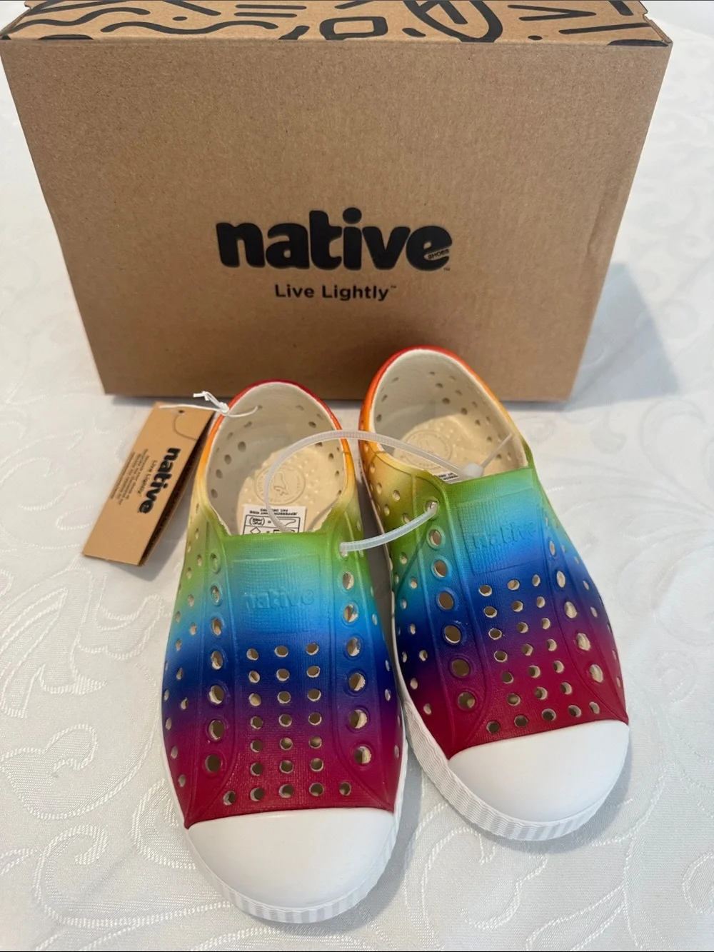Native Kids Slip-On Sneaker in Rainbow Gradient. Size C8